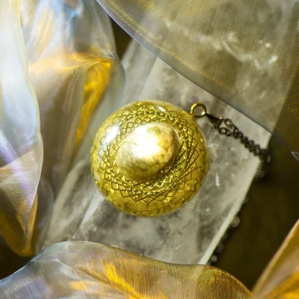 Close-up view of the labradorite crystal orgone pendant, showcasing its radiant energy and healing properties for personal growth and protection.