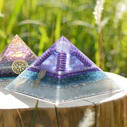 Crystal Energy Orgonite Pyramid designed to assist in manifesting abundance, unlocking energetic flow, and creating harmony between the physical and spiritual realms.